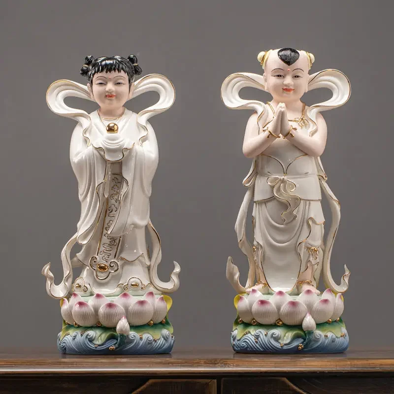 Ceramic ornaments, golden boy and jade girl Buddha statues are offered to serve in front of the household Buddha