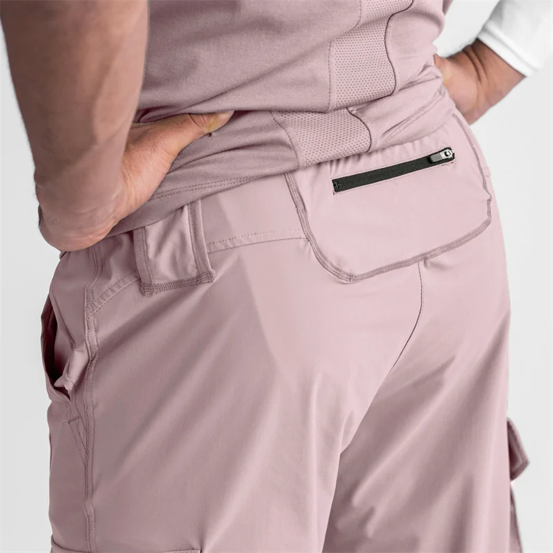 Pantalones deportivos de gimnasio para hombre, ropa de calle para fitness al aire libre, elásticos, con múltiples bolsillos, a la moda, novedad de