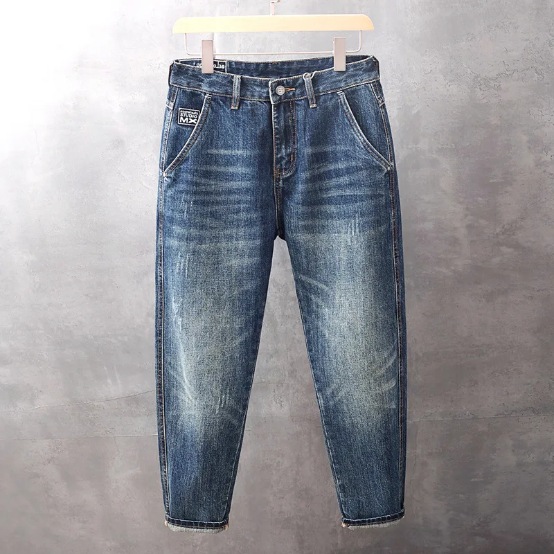 Celana denim pria musim gugur terbaru, warna terang, efek cuci, model sedikit meruncing, longgar, trendi, serbaguna, dan ramping.