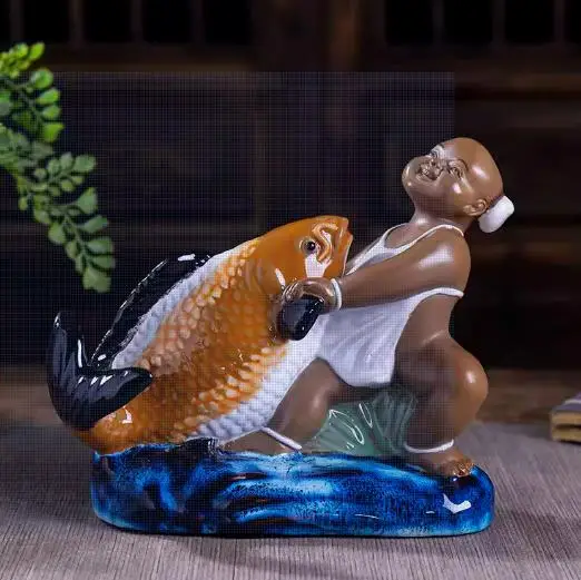 

Ceramic Shiwan Kiln--- Baby catches fish porcelain statue