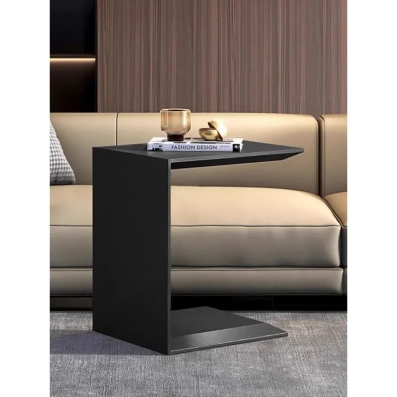 Simple black oak edge, small apartment living room sofa next to the corner