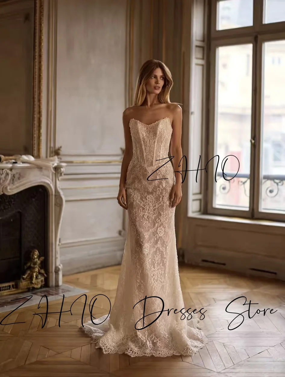 ชุดแต่งงานหรูหรา ZHIO ประดับมุก คอร์เซ็ทแบบผูกคอ ทรงเมอร์เมด ชายกระโปรงยาวลากพื้น สีไอวอรี่ ผ้าลูกไม้ ชุดราตรีเจ้าสาว สามารถสั่งตัดได้