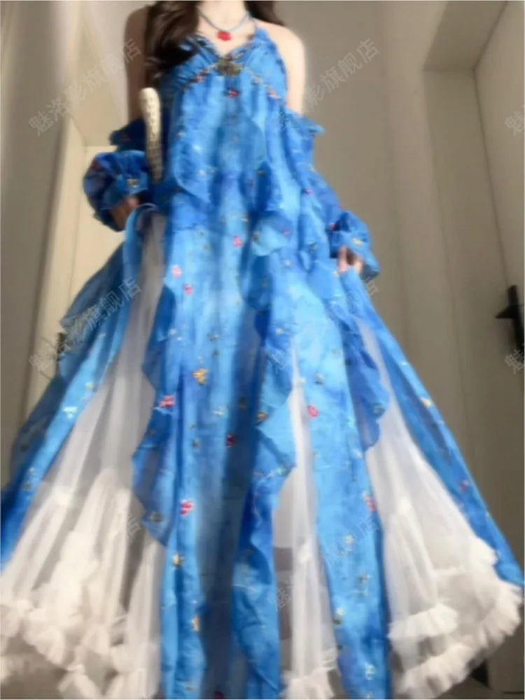 

A stylish blue ruffled backless seaside vacation style long dress with blend of roses
