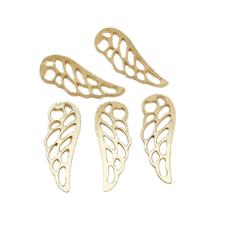 Factory Direct Sales 100Pieces diy Ornament 24x9mm Fitted Wings Hollow Wing Pendant Clothing Bags Zipper Head Materials