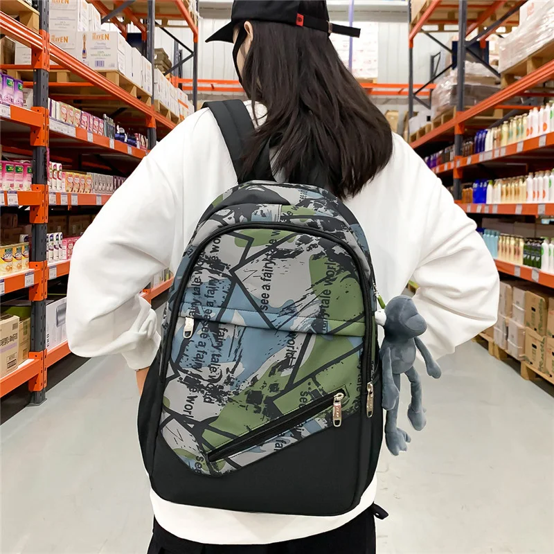 

New female backpack Korean version junior high school student schoolbag men's fashion trend youth leisure travel backpack