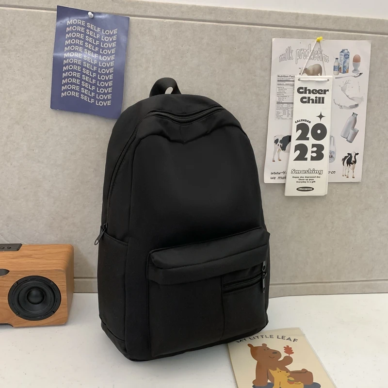 シンプルなソリッドカラーのカジュアルバックパック、軽量で多用途な高校生バッグ、ハンギングアウト用の多用途なソリッドカラーのデイパック
