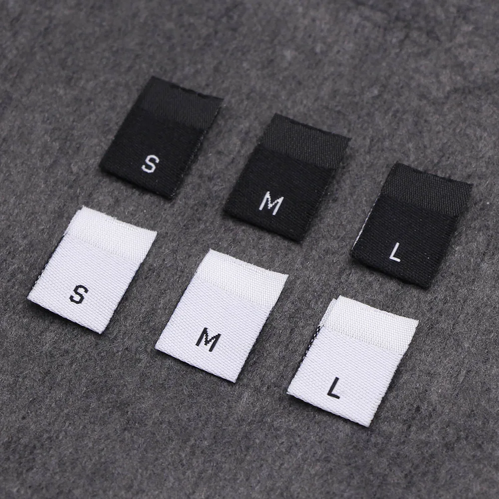 100 pezzi etichetta taglia abbigliamento nero bianco XS SML XL 2XL 3XL 4XL etichette per vestiti abbigliamento fai da te maglietta abito 12x35MM etichetta tag