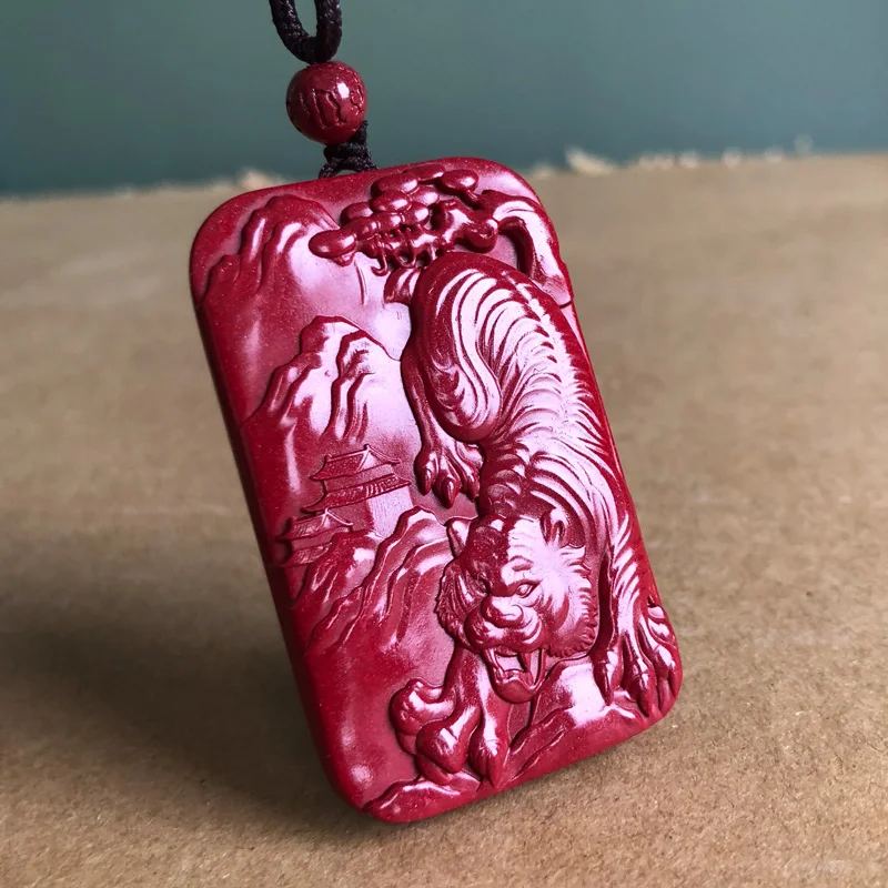 Zijin cinnabar tiger pendant  mountain gives birth to power. Male and female side cards are the patron saint of tiger pendant.