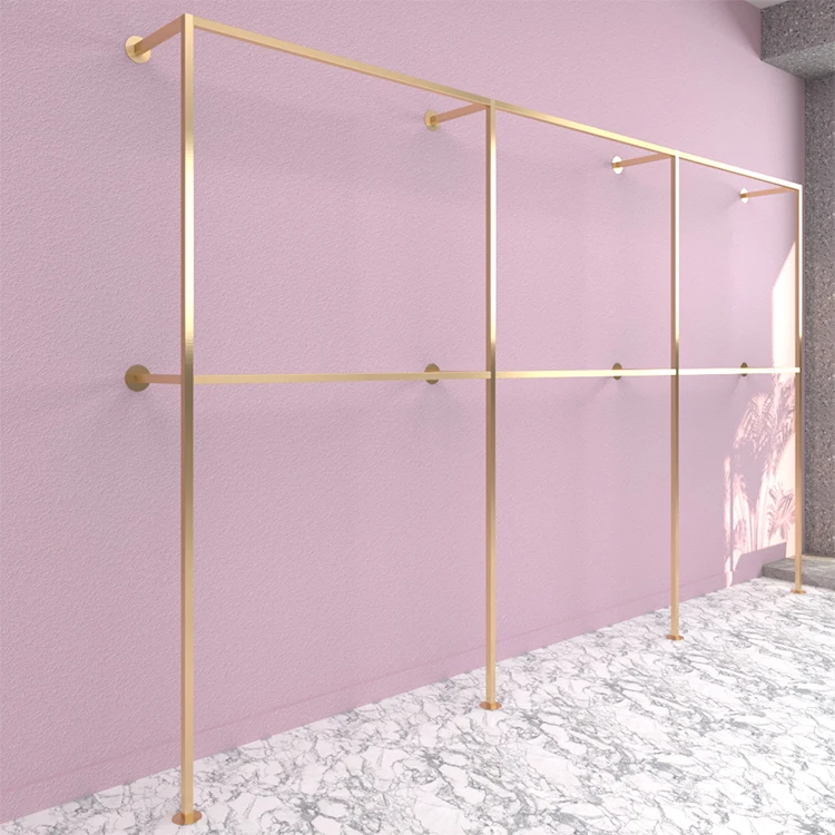 Women's retail store fixture design luxury gold stainless steel store clothing wall mounted display stand