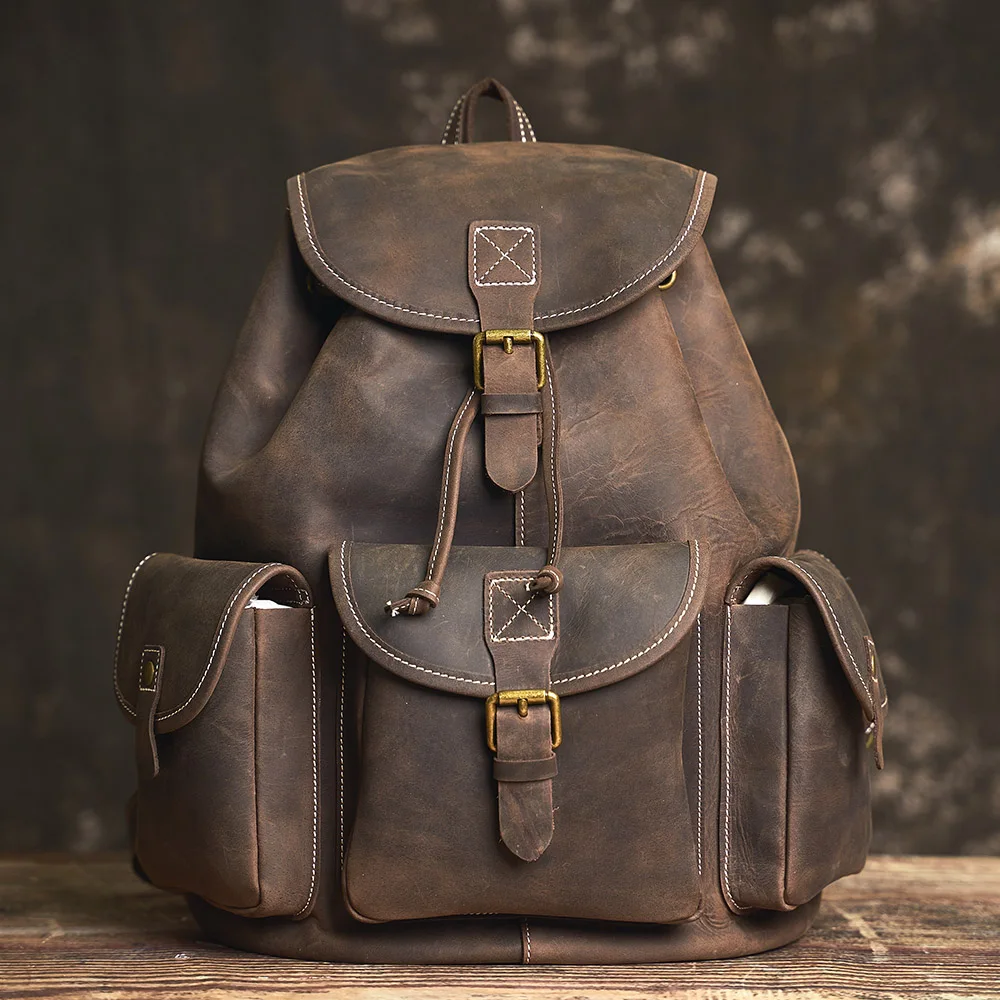 Mochila Retro NUPUGOO para hombre, mochila escolar con cordón de estilo moderno de cuero auténtico, bolsa de viaje para ordenador portátil de 16 pulgadas