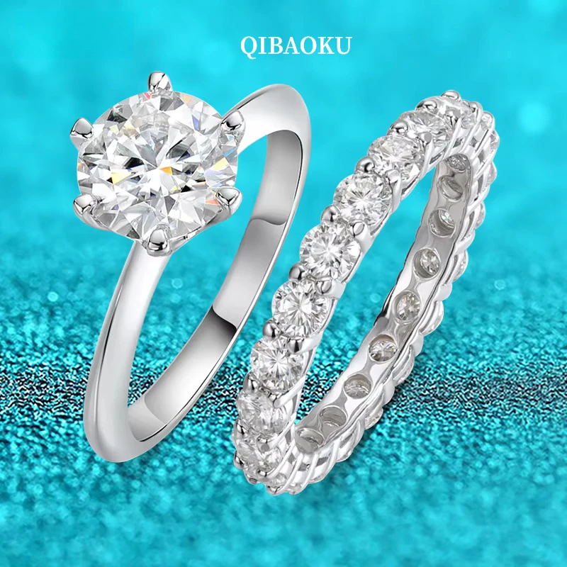 QIBAOKU 3.1-4.1CTTW D Color Moissanite Proposal Rings for Women Sparkling 100% S925 Sterling Silver Party Jewelry Wholesale 2026