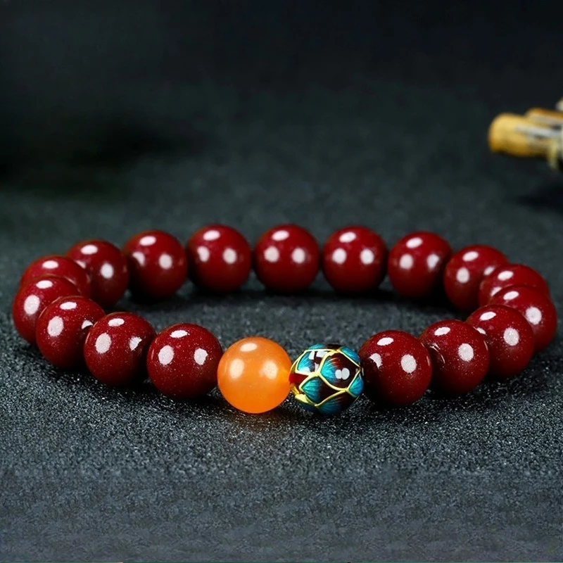 

Классический браслет в этническом стиле ретро с одним круглым бусином из киновари.