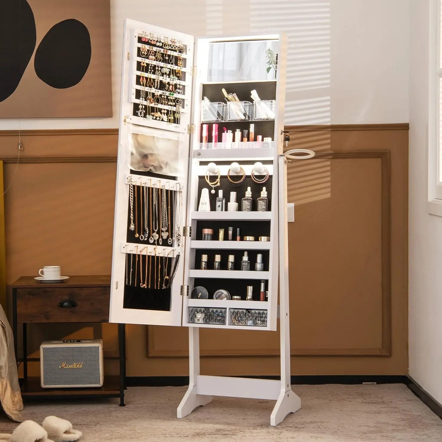 Jewelry armoire interior showing flip-open vanity mirror with LED lights and necklace hooks