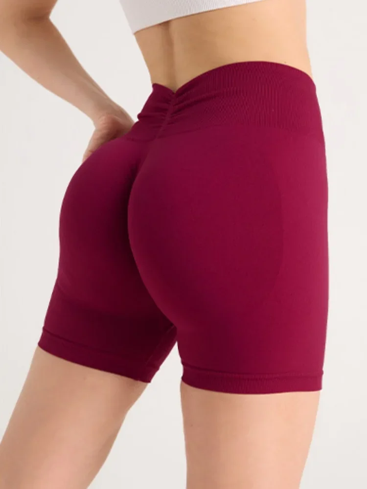 Shorts de ioga apertados para exercícios de secagem rápida com quadril pêssego sem costura