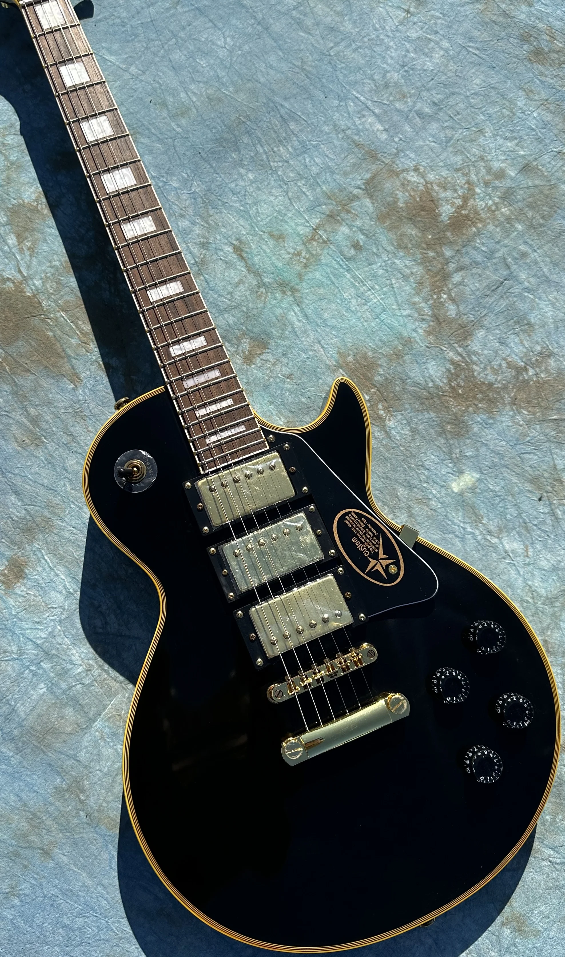 Customized electric guitar, black caston, yellow logo and body binding,3 pickups，gold accessories, lightning package