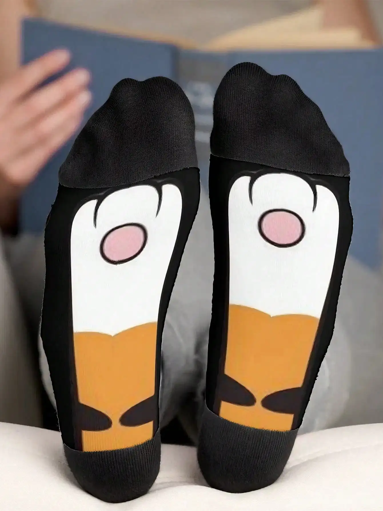 

A pair of cute and funny mid-calf socks with dog front and back paw patterns that are comfortable to wear.