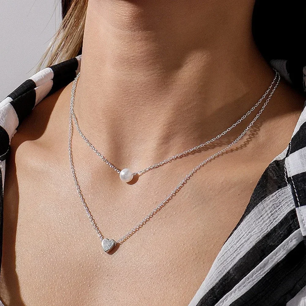 Nuevo collar de doble capa para mujer, gargantillas con colgante de corazón de cristal y perlas de imitación, collares para niñas, regalo bohemio, joyería barata