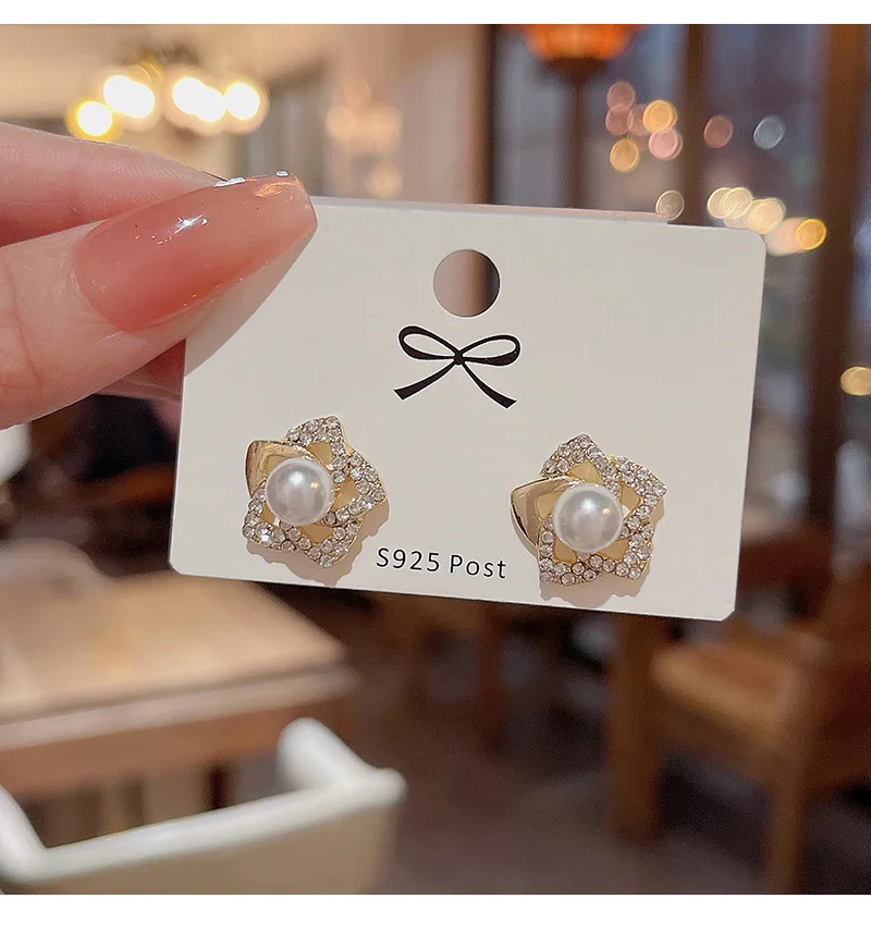 Exquisite diamond studded rose earrings with a luxurious and socialite style design, featuring pearl earrings and earrings