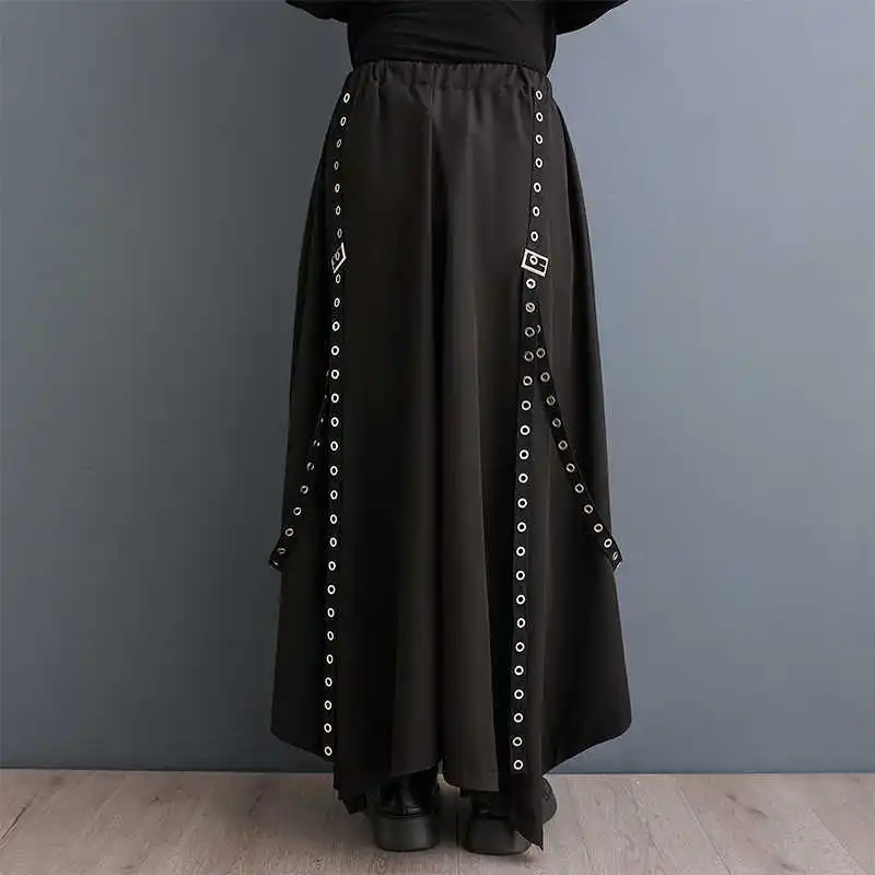 Pantalones de pierna ancha irregulares Y2k para hombres y mujeres, pantalones Harajuku negros Steampunk, pantalones de falda Punk de vendaje con remaches, moda Coreana de gran tamaño