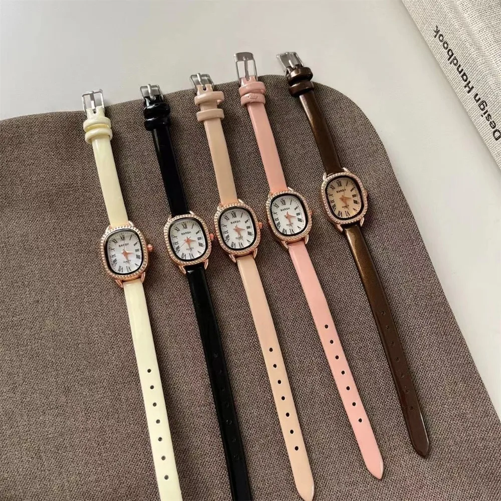 ساعة نسائية بسيطة رفيعة بحزام جلدي موضة بيضاوية بمينا روماني ساعات كوارتز للنساء ساعات يد فاخرة هدية للسيدات