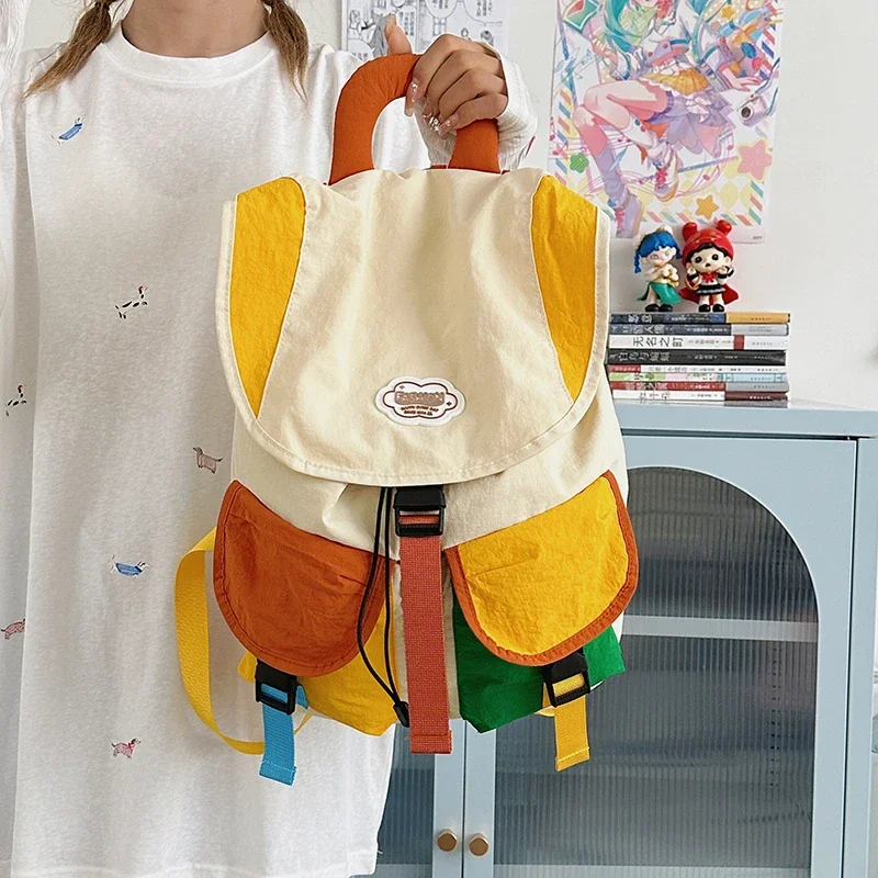 

Повседневный стильный дизайн, креативные нейлоновые рюкзаки соответствующего цвета для женщин, 2026, горячая распродажа, прочная портативная школьная сумка большой вместительности