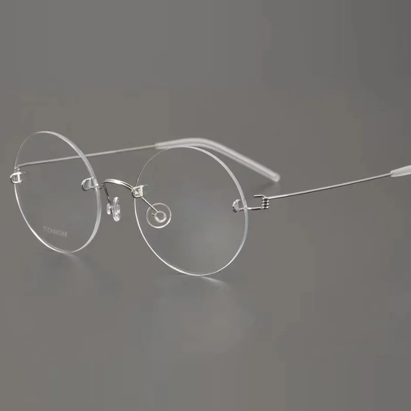 JD LIND pure titanium rimless myopia glasses with small round frame and thin legs, thin wire rimless frames with lenses.