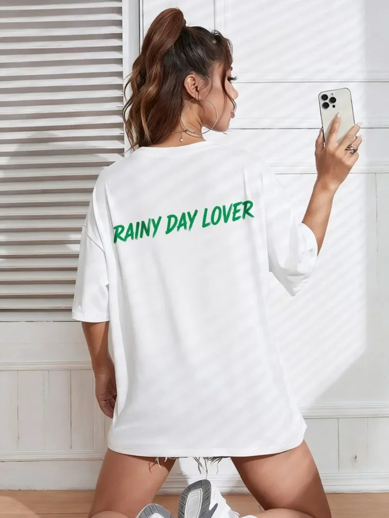 

White Loose Short-sleeved T-shirt with Green "RAINY DAY LOVER" Printed Text on The Back Is Casual, Fashionable and All-matching