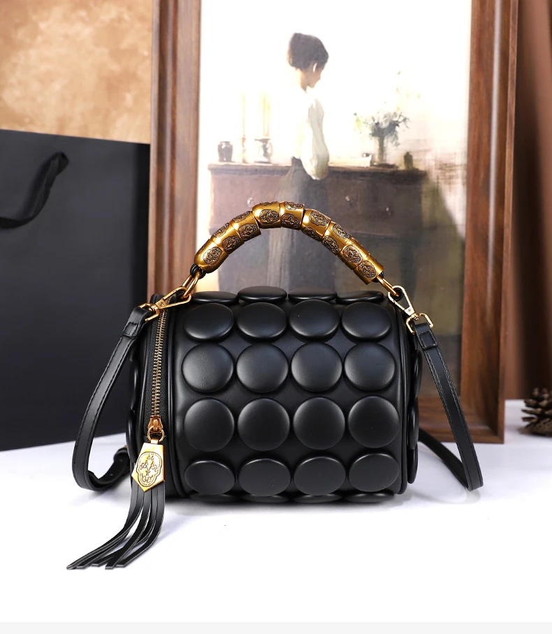 2026 Neues Design Damen Retro-Knopf-Lederhandtaschen Luxuriöse High-End Runde Röhrenförmige Bucket Bag Neue Mode Schulter-Umhängetasche – Detail 1