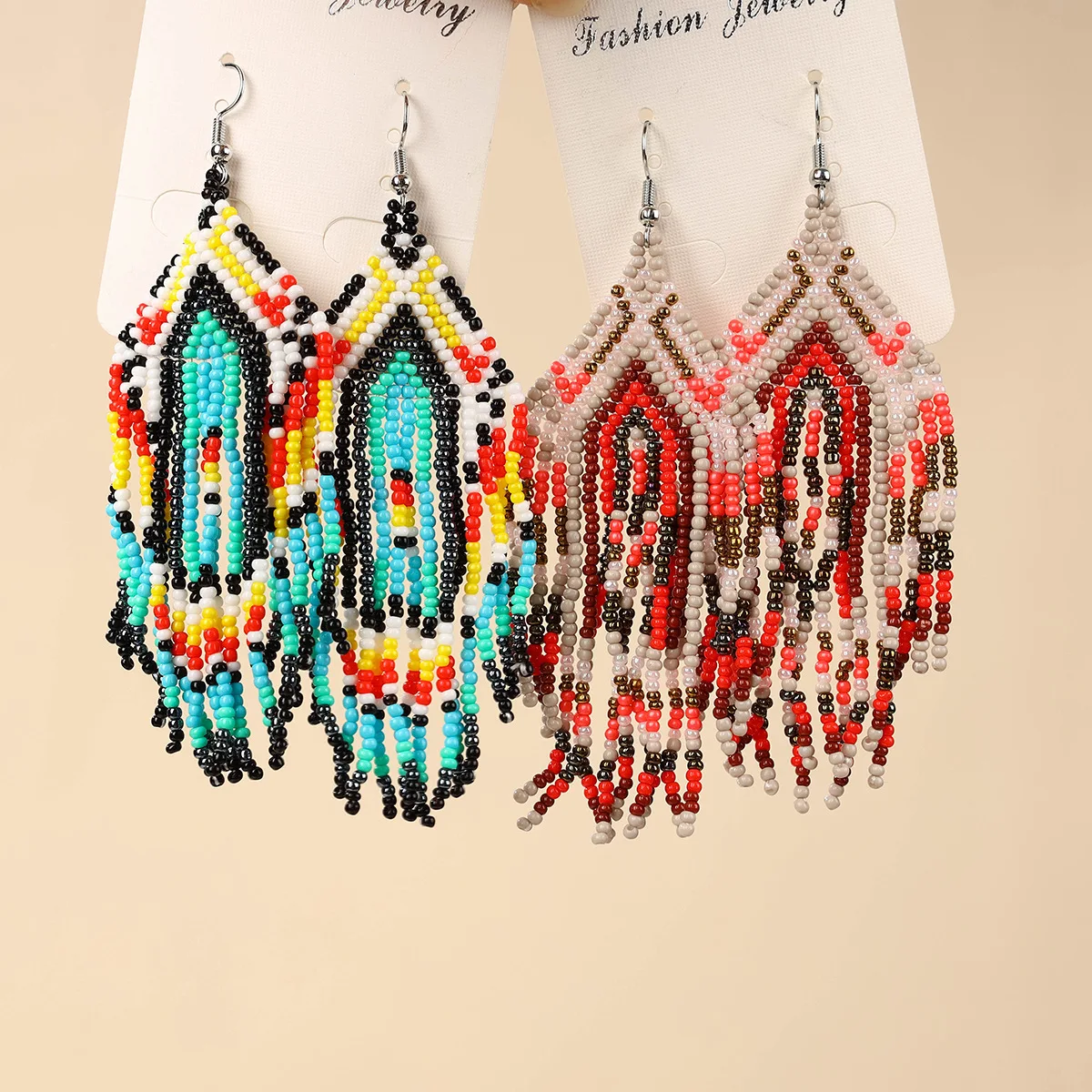 

Beaded earrings Tassel Geometry Design Originality Hand knitting Bohemia Alloy Tide Simple Rice bead earrings