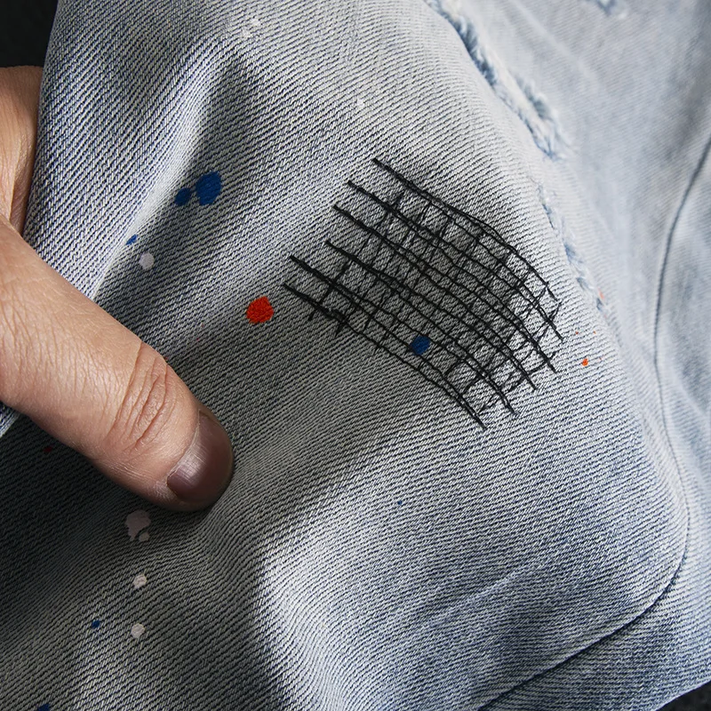 Splash ink ripped jeans for men, slim fit with small feet, elastic and scraped patch design, spring/summer 2025 new pants