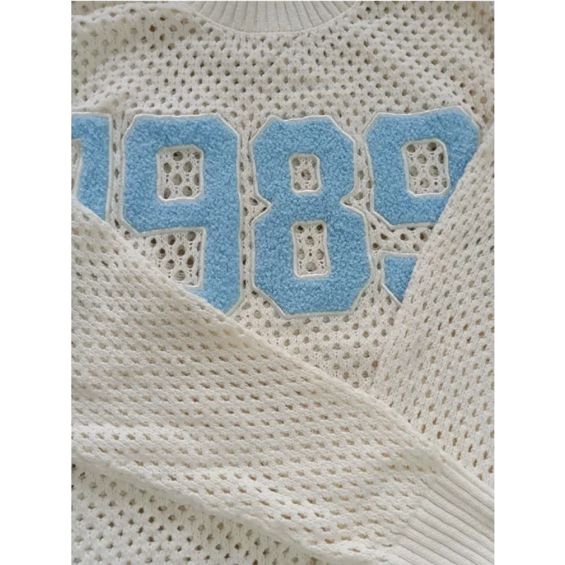 سترة Taylor's Open Knit غير الرسمية المصنوعة من المشجعين باللون البيج والأبيض 005