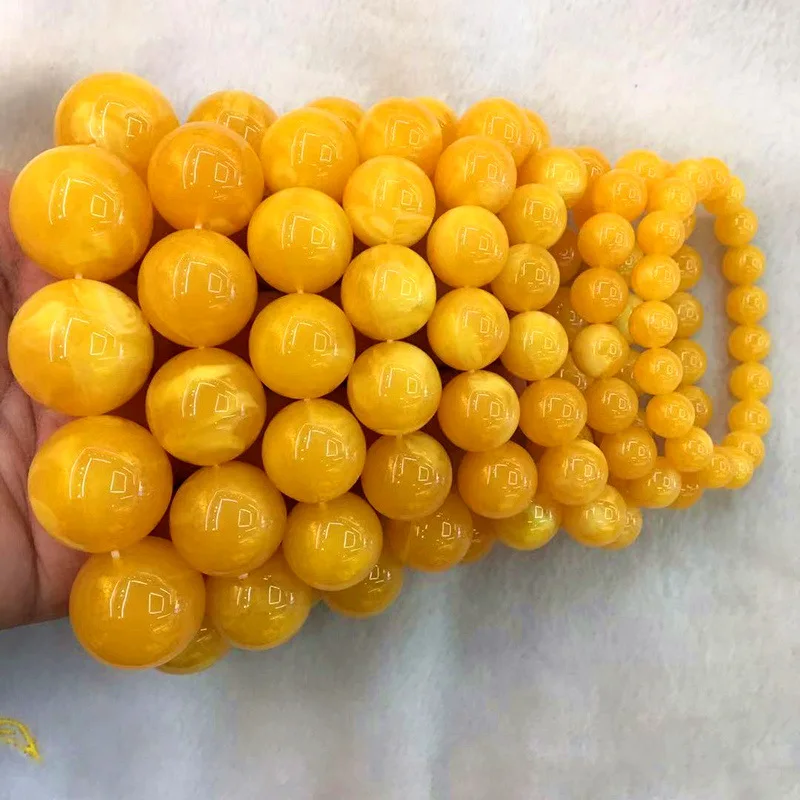 Natural second-generation bracelet with chicken oil yellow and floral patterns, Buddhist head charm, old amber prayer bead