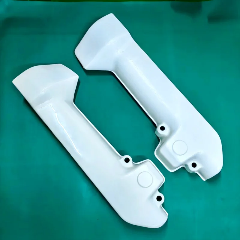 Front Shock Absorber Left and right guard Plates. Suitable for XRV750 Africa Twin from 1997 to 2002.