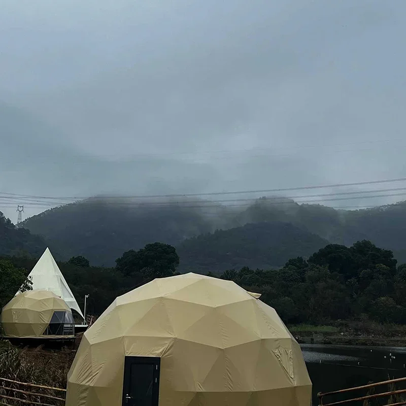 A luxury dome tent with a private bathroom and kitchenette, ideal for a hotel-style outdoor stay