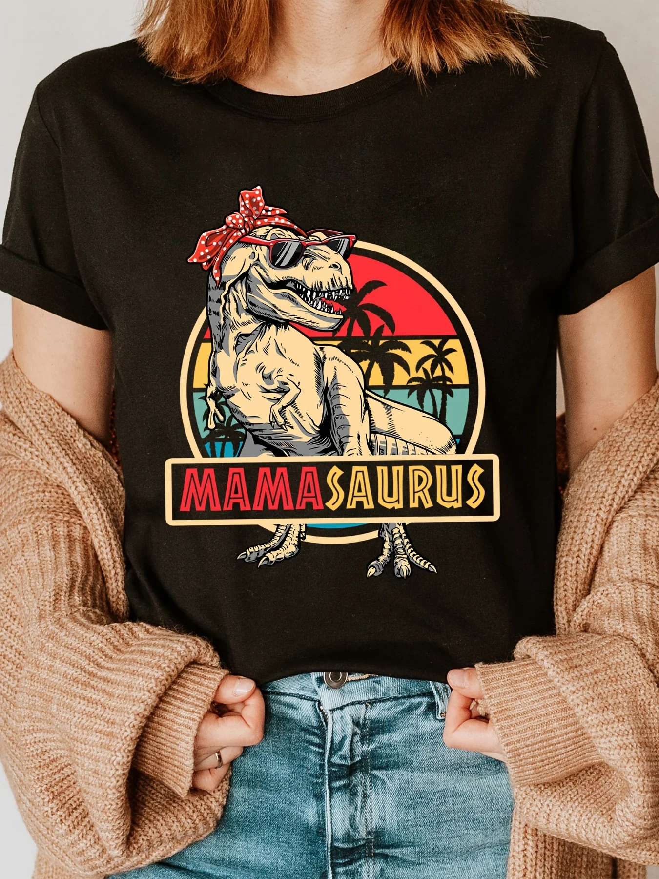 

Mamasaurus Women's Black Cotton T-Shirt - Short Sleeve Crew Neck Casual Top with Playful T-Rex Fashion Glasses & "MAMA SAURUS"