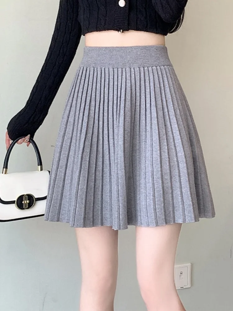 SMTHMA Gonna lavorata a maglia a pieghe calda 2025 Nuova gonna corta a vita alta autunno inverno Gonna a trapezio dimagrante da donna