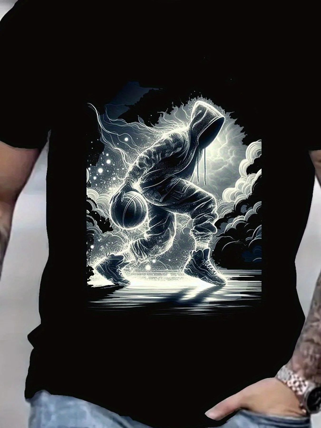 A Black T-Shirt Showcasing Vibrant Graphics with a Luminous Basketball Motif - Stylish And Contemporary Design - Perfect for Casual Gatherings, Athletic Occasions, Or Urban Fashion