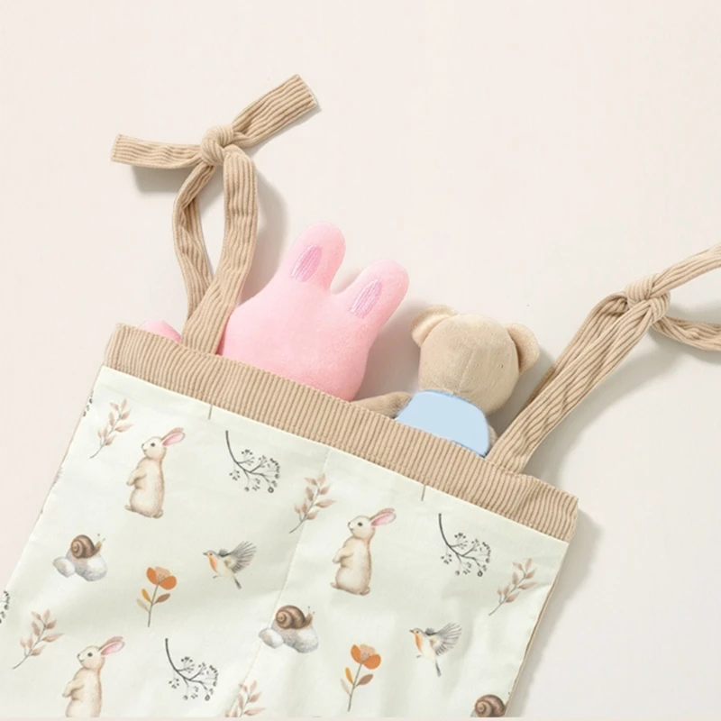 新しい漫画柄ベビーベッド吊り下げ収納バッグ、柔らかいコーデュロイ製ベビーベッドオーガナイザー、ベビーおむつ、哺乳瓶、おもちゃ用の複数のポケット付き