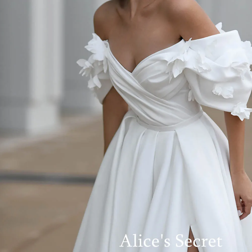 

Romantique A-Line Wedding Dress Off-Shoulder Sweetheart Short Puff Sleeves Flowers Draped High Slit Floor Length Court Train