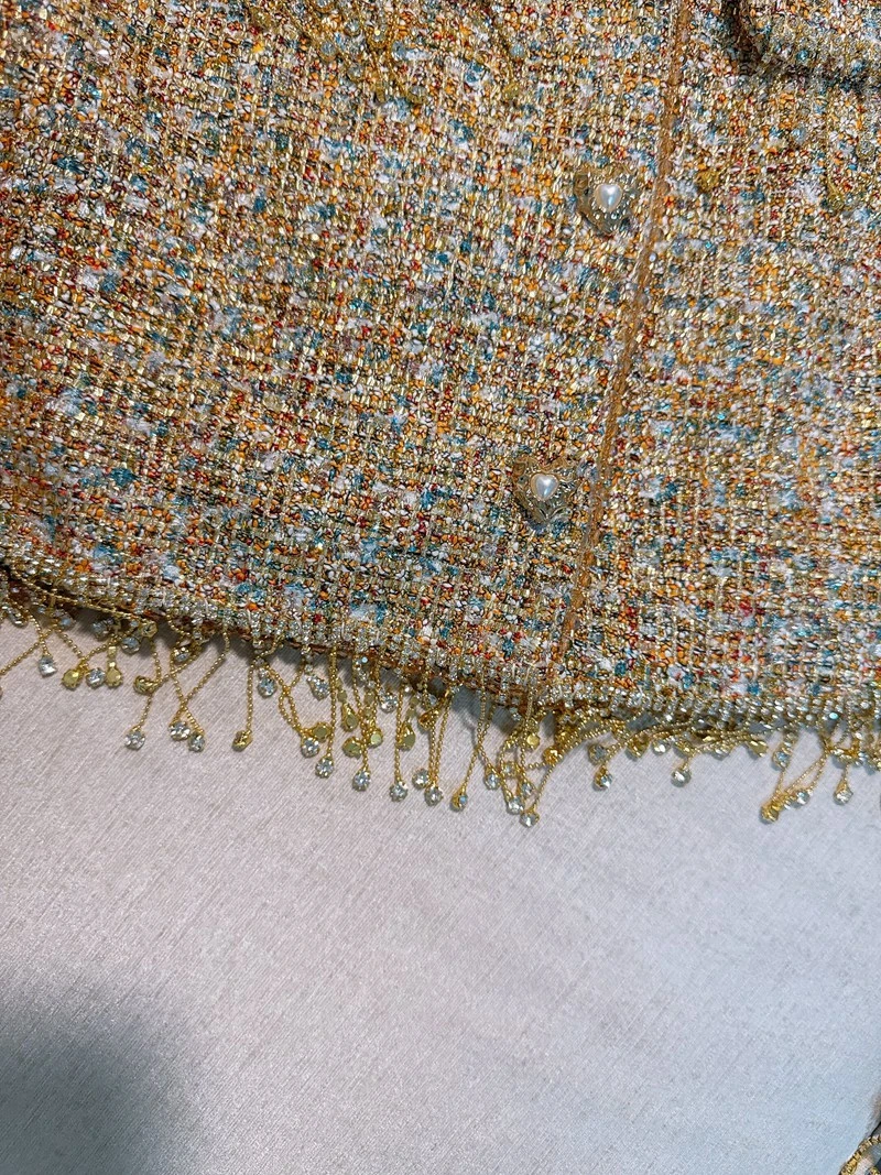   เสื้อโค้ทขนเฟอร์เทียมแบบไม่มีลายเย็บติดกัน พร้อมพู่ห้อย สไตล์ฝรั่งเศส ทรงเข้ารูปสำหรับผู้หญิง เสื้อคลุมฤดูใบไม้ร่วง ทำจากเส้นใยโพลีเอสเตอร์