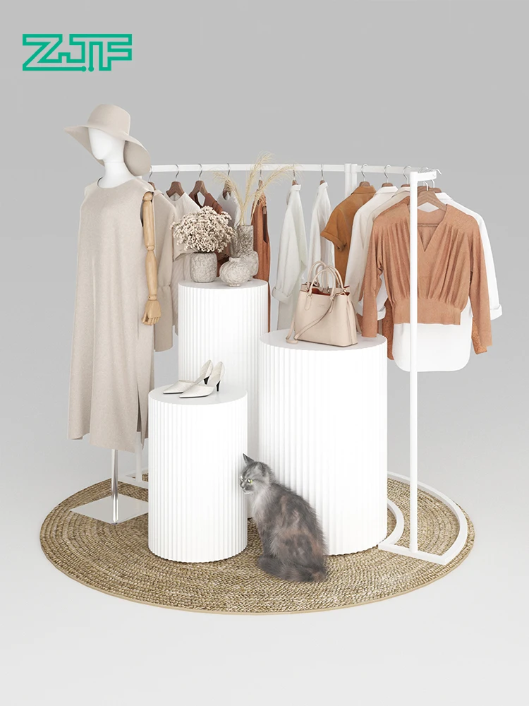 

Women's clothing store displays clothing on the island display stand display shelves, clothing display shelves, white