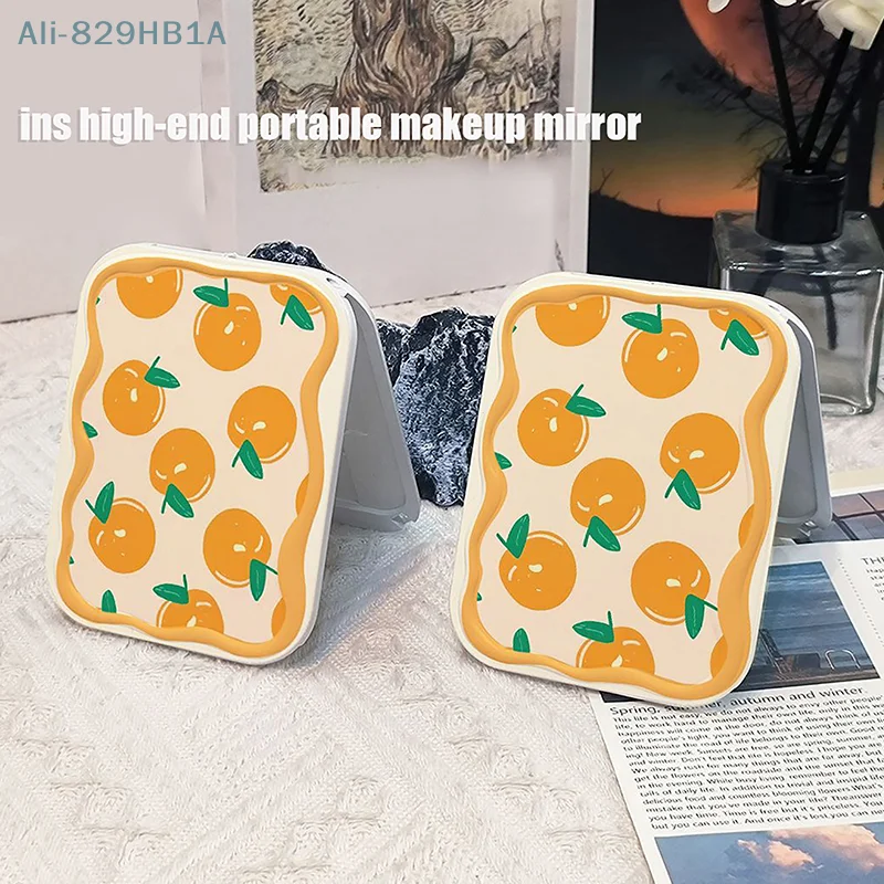 Espejo de maquillaje plegable con patrón naranja completo, espejo de bolsillo portátil, espejo cosmético rectangular con peine para mujeres y niñas