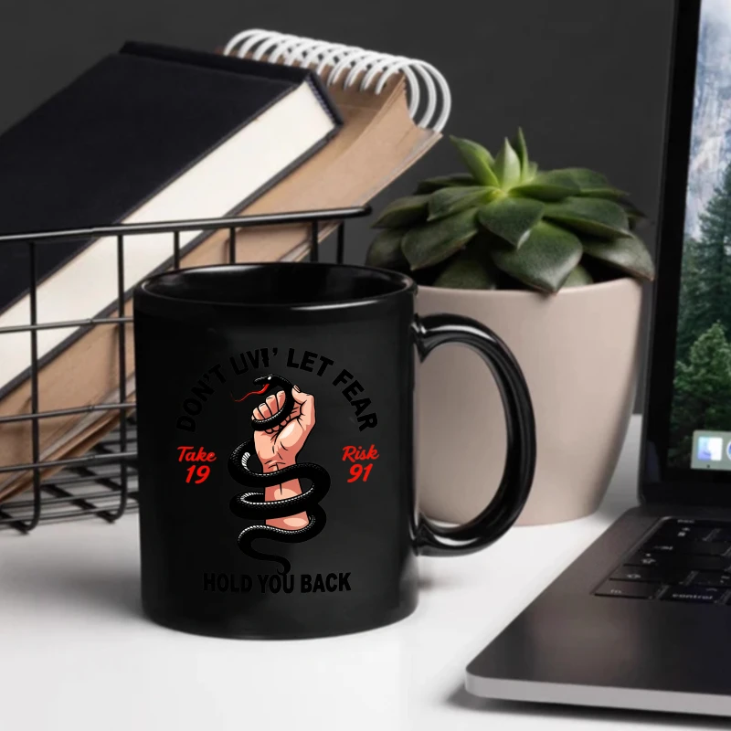 Black ceramic mug with snake and hand design. Don't let fear hold you back, take a brave step. 91 inspirational quotes for peopl