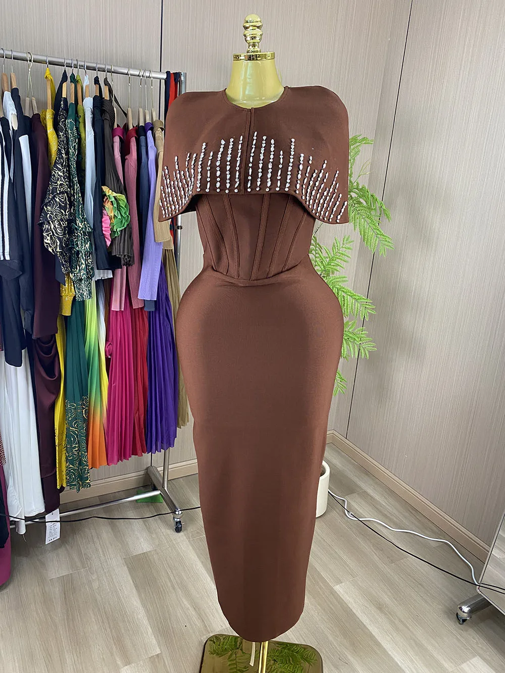 Sleeveless, sexy, lace-up evening gown featuring rhinestone embellishments and a cape-style design.-GZXX1167