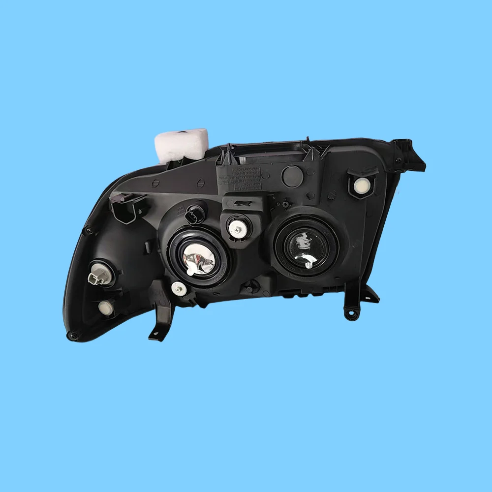 A pair of black headlights specifically designed for the Land Cruiser LC100 FJ100 2005-2007 model - Image 6