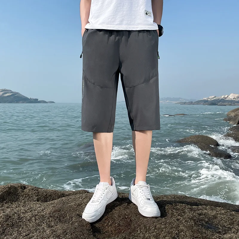 Pantalones cortos sueltos informales para hombre, Shorts deportivos finos transpirables a la moda, simplicidad de verano, cinco Pantalones rectos