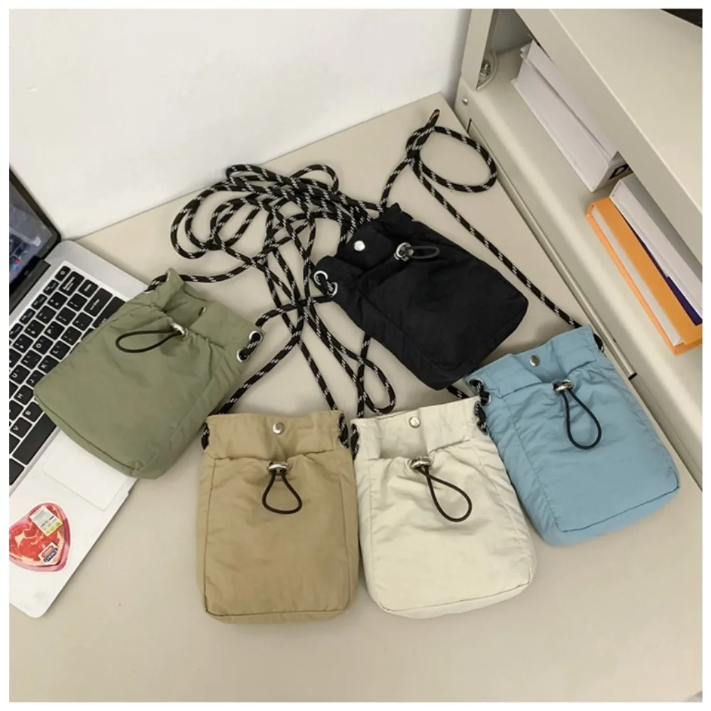 Nylon cloth ultra-light lady's crossbody small bag with drawstring opening and strap bag, waterproof men's mini shoulder bag