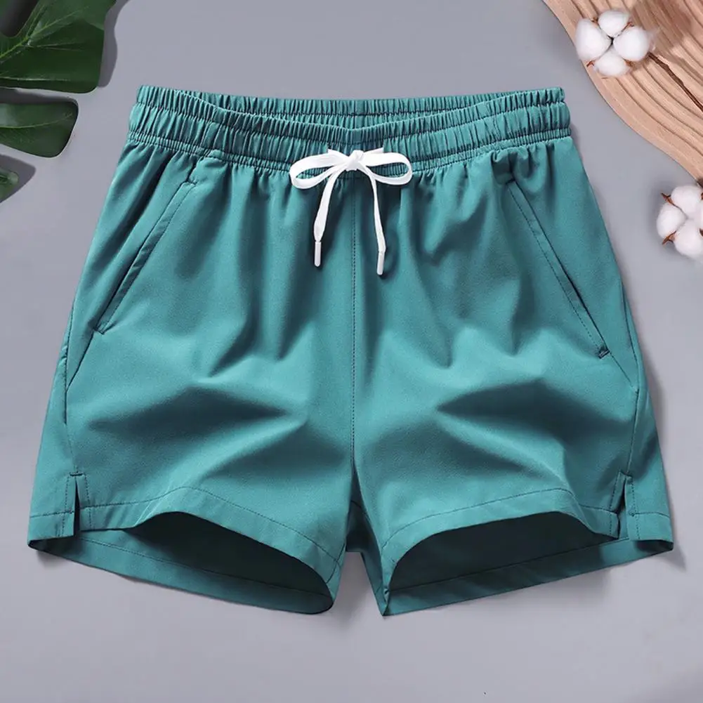 Men Summer Casual Shorts Mid-rise Elastic Waistband Pockets Beach Shorts Solid Color Wide Leg Loose Fit Fitness Shorts