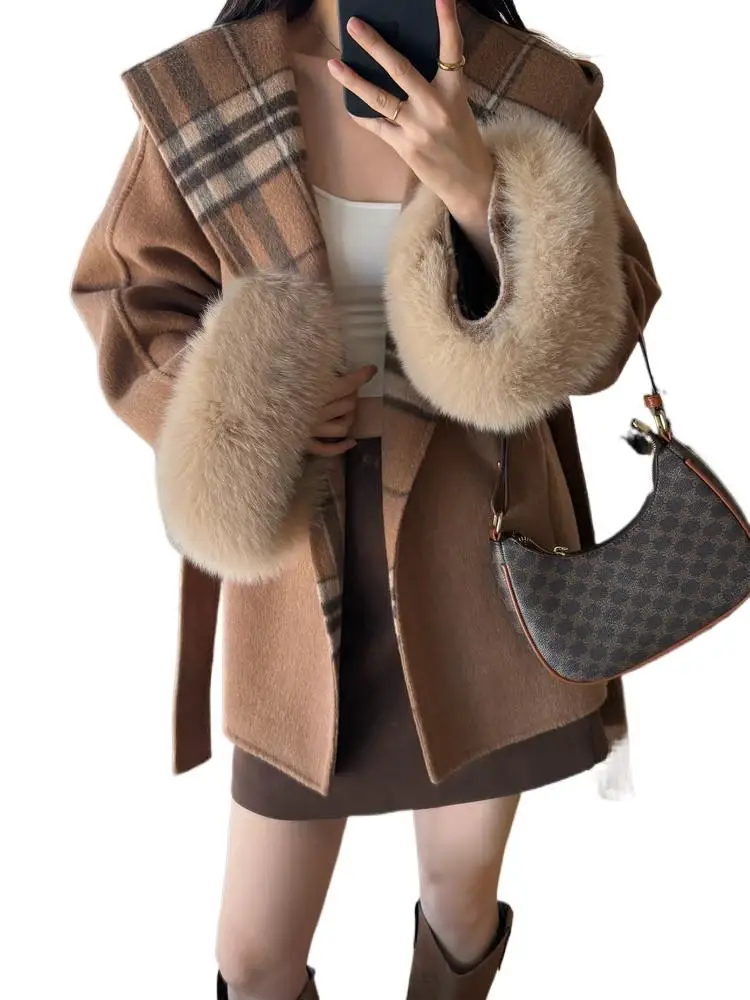 Jiuwei Family's new Autumn/Winter 2025 collection features a hooded sleeve fox fur double-sided woolen overcoat for women