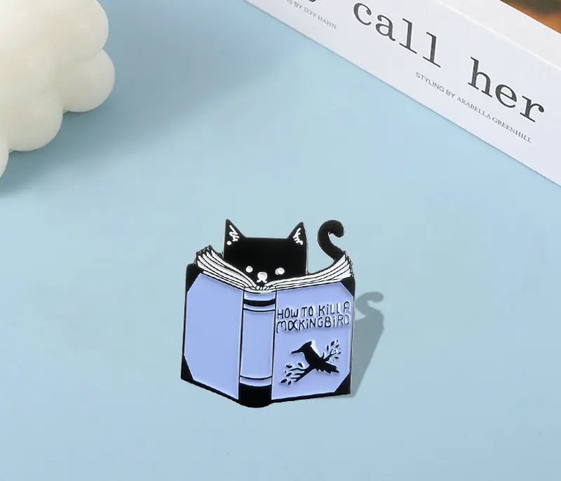 Reading Cat Enamel Pin Custom Animal Book Brooches Bag Clothes Lapel Pin How to Kill A Mocking Bird Badge Creative Jewelry Gift